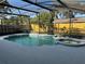 The screened-in pool features a serene swimming pool, hot tub, and outdoor space at 645 Peachwood Dr, Altamonte Springs, FL 32714