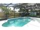 Screened-in pool with lush backyard views, great for outdoor relaxation at 645 Peachwood Dr, Altamonte Springs, FL 32714
