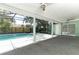View of screened-in pool area with pillars, ceiling fans, and a lush backyard at 645 Peachwood Dr, Altamonte Springs, FL 32714