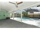 Covered pool area with ceiling fans, pillars, and an attached jacuzzi for ultimate relaxation at 645 Peachwood Dr, Altamonte Springs, FL 32714