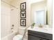 Full bath featuring shower-tub combo, single sink vanity, and Mickey Mouse decor at 671 Drop Shot Dr, Davenport, FL 33896