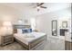 Cozy bedroom with a comfortable bed, soft linens, and a view into the attached bathroom offering convenience at 671 Drop Shot Dr, Davenport, FL 33896