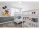 Bedroom with 2 sets of bunkbeds and fun Mickey Mouse themed wallpaper at 671 Drop Shot Dr, Davenport, FL 33896