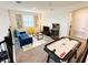 Fun loft space featuring an air hockey table, game console, and comfortable seating for leisure and entertainment at 671 Drop Shot Dr, Davenport, FL 33896