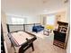 Upstairs loft featuring an air hockey table, gaming machine, seating, and space for entertaining at 671 Drop Shot Dr, Davenport, FL 33896