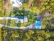 Aerial view of the property showing the home, pool, outbuilding, and surrounding land at 6975 Maverick Trl, St Cloud, FL 34771