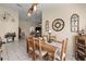 Cozy dining room with rustic wooden table, chair set, and stylish decor at 6975 Maverick Trl, St Cloud, FL 34771