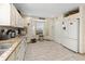 Bright kitchen featuring white cabinets, granite countertops, a bay window, and stainless steel appliances at 6975 Maverick Trl, St Cloud, FL 34771