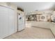 Open concept kitchen with granite counters, white cabinets and stainless steel appliances at 6975 Maverick Trl, St Cloud, FL 34771