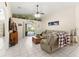 Inviting living room with a comfortable seating area, and sliding doors leading to the pool at 6975 Maverick Trl, St Cloud, FL 34771