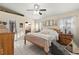 Serene main bedroom featuring a comfortable bed, ensuite bathroom, and decor at 6975 Maverick Trl, St Cloud, FL 34771