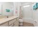 Bathroom with a shower and tub combination and updated vanity at 7017 Oakwood St, Davenport, FL 33837