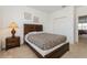 Bedroom featuring a wood bed frame and a leopard print bedspread, creating a stylish space at 7017 Oakwood St, Davenport, FL 33837
