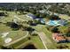 Aerial view of the neighborhood including the golf course, swimming pool, and clubhouse at 708 Wilson Rd, Winter Springs, FL 32708