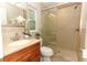 Bathroom featuring a glass-enclosed shower, wood vanity and sink at 708 Wilson Rd, Winter Springs, FL 32708