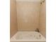 Close up of a tile shower and jet tub combination in a bathroom at 708 Wilson Rd, Winter Springs, FL 32708
