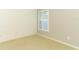 Bedroom showcasing natural light, neutral walls, and light carpet at 708 Wilson Rd, Winter Springs, FL 32708