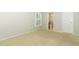 Empty bedroom with neutral walls, a window, and a glimpse into the adjoining bathroom at 708 Wilson Rd, Winter Springs, FL 32708