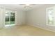 Bright bedroom featuring neutral paint, ceiling fan, and sliding glass door to the outdoor area at 708 Wilson Rd, Winter Springs, FL 32708