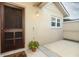 Charming home entrance featuring a stylish wooden front door and exterior lighting at 708 Wilson Rd, Winter Springs, FL 32708