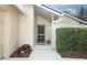Inviting entryway with a decorative front door, potted plants, and neatly trimmed landscaping at 708 Wilson Rd, Winter Springs, FL 32708