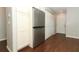 Kitchen area featuring a stainless steel refrigerator, closet, and wood floors at 708 Wilson Rd, Winter Springs, FL 32708