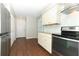 Spacious kitchen with stainless steel appliances, granite countertops, and white cabinetry at 708 Wilson Rd, Winter Springs, FL 32708