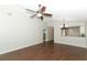Spacious living area with hardwood floors and views of the open kitchen and dining area at 708 Wilson Rd, Winter Springs, FL 32708