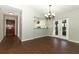Bright living room featuring hardwood floors with open layout to kitchen and dining area at 708 Wilson Rd, Winter Springs, FL 32708
