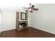 Inviting living room featuring a brick fireplace, ceiling fan, and hardwood floors at 708 Wilson Rd, Winter Springs, FL 32708