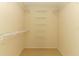Interior view of a walk-in closet with metal shelving at 708 Wilson Rd, Winter Springs, FL 32708