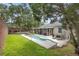 Spacious backyard featuring a swimming pool, patio, and lush green lawn at 714 Home Grove Dr, Winter Garden, FL 34787