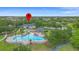 Community pool with a clubhouse, lounge chairs, landscaping, and a walking path at 714 Home Grove Dr, Winter Garden, FL 34787