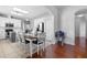 The dining area is adjacent to the kitchen, featuring a table and white and brown wooden chairs at 714 Home Grove Dr, Winter Garden, FL 34787