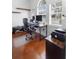 Bright home office featuring hardwood floors, floating shelves, and a large window for plenty of natural light at 714 Home Grove Dr, Winter Garden, FL 34787