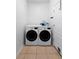 Modern laundry room featuring a front-load washer and dryer set, with white walls and neutral flooring at 714 Home Grove Dr, Winter Garden, FL 34787