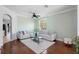 Inviting living room with hardwood floors, neutral paint, a ceiling fan and filled with ample natural light at 714 Home Grove Dr, Winter Garden, FL 34787