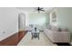 Bright living room featuring hardwood floors, neutral paint, a ceiling fan and filled with ample natural light at 714 Home Grove Dr, Winter Garden, FL 34787