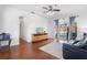 Light-filled living room with hardwood floors and sliding doors to the outdoor pool area at 714 Home Grove Dr, Winter Garden, FL 34787