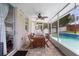 Outdoor patio with a dining table and chairs overlooking a sparkling pool and landscaped backyard at 714 Home Grove Dr, Winter Garden, FL 34787