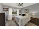 Comfortable bedroom with a ceiling fan, soft decor, and neutral paint at 722 Ridgewood Way, Winter Springs, FL 32708