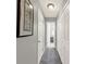 Clean hallway with white doors, carpeted floor, and neutral paint at 722 Ridgewood Way, Winter Springs, FL 32708