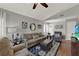 Bright living room with hardwood floors, comfortable seating, vaulted ceiling, and decor at 722 Ridgewood Way, Winter Springs, FL 32708