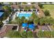 Aerial view of the community pool and playground, surrounded by lush landscaping and well-maintained facilities at 8419 Pippen Dr, Orlando, FL 32836