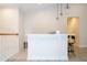 Close-up of the bar area, featuring pendant lighting, countertop seating, and views of the upstairs landing at 8419 Pippen Dr, Orlando, FL 32836