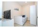 Cozy bedroom featuring a twin bed, TV, and white furniture, ideal for children or guests at 8419 Pippen Dr, Orlando, FL 32836