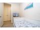 This cozy bedroom has a twin bed, TV, and access to closet storage at 8419 Pippen Dr, Orlando, FL 32836