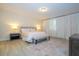 Tranquil bedroom with soft lighting, light wood floors, and a comfortable queen bed at 8419 Pippen Dr, Orlando, FL 32836