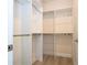 Organized walk-in closet with built-in shelving and plenty of storage space at 8419 Pippen Dr, Orlando, FL 32836