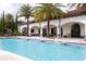 Stunning community pool with water features, comfortable seating, and shade for residents to enjoy at 8419 Pippen Dr, Orlando, FL 32836